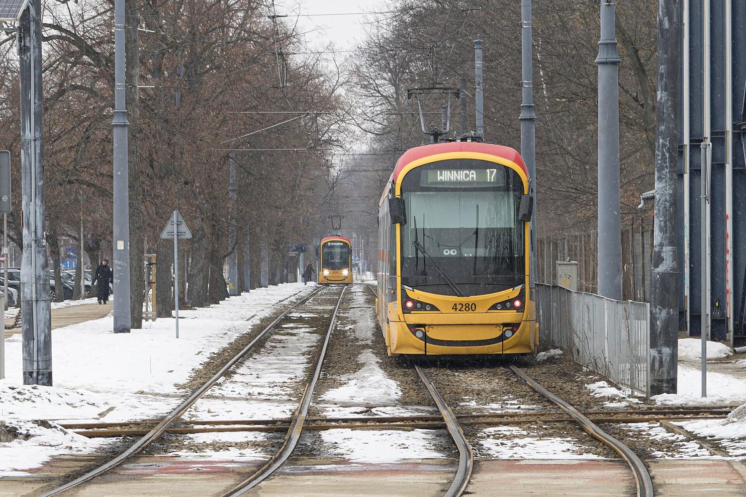 A tram on snowy tracks in Warsaw